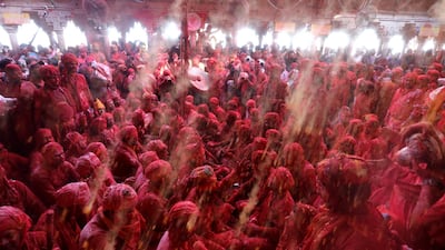 Hindu men from the villages of Nandgaon and Barsana celebrate at the Radha Rani temple in Barsana village, Mathura, India. EPA