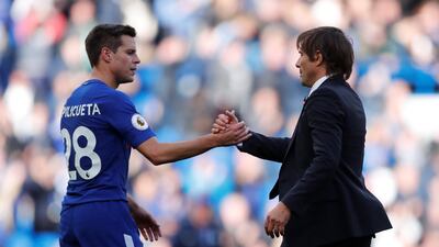 Cesar Azpilicueta, left, shaking hands with Antonio Conte, scored for Chelsea against Watford. Eddie Keogh / Reuters