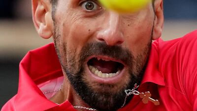 Serbian Novak Djokovic has his eye on the ball as he plays a backhand return to Italy's Jannik Sinner during their men's singles semi-final match on day 13 of the French Open tournament on Court Philippe-Chatrier at the Roland-Garros Complex in Paris. AFP
