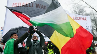 Demonstrators wave the Belgium and Palestinian flags as they gather to protest the arrival of Israeli prime minister Benjamin Netanyahu in Brussels on December 11, 2017. Stephanie Lecocq / EPA