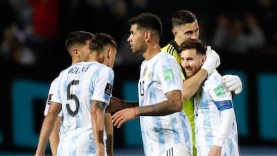 Argentina's Lionel Messi (R) and goalkeeper Emiliano Martinez celebrates after defeating Uruguay. AFP