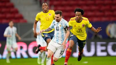 Argentina's Lionel Messi and Colombia's Juan Cuadrado battle for the ball.