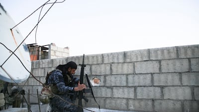 A soldier carries out safety checks. AP