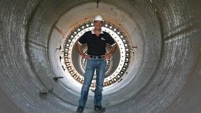 David Chambers of Trident Support stands inside a section of the flagpole built for Azerbaijan.
