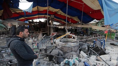 A man stands near the rubble at the site of a truck blast in Azaz, Syria. REUTERS