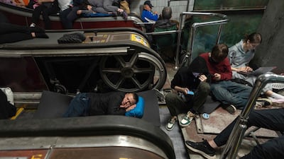 People take shelter at a metro station during a Russian missile strike on Kyiv, Ukraine. AFP