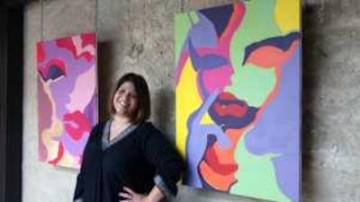 Noor al Suwaidi with examples of her work at the Art Connection gallery in Bastakiya, Dubai.