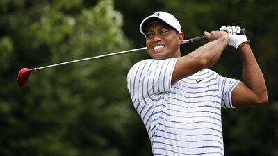 Tiger Woods winces after his tee shot on the sixth hole during the second round of the PGA Championship at Valhalla Golf Club in Louisville, Kentucky, on August 8, 2014. Jeff Roberson / AP Photo