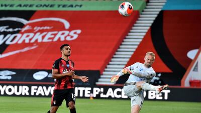 Leicester City's Kasper Schmeichel kicks the ball in frustration after Bournemouth's Junior Stanislas (left) scores his side's opening goal from the penalty spot. PA