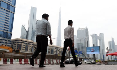 People walking in Downtown, Dubai. Those who have lived here carry memories of the country and its people long after they leave. Chris Whiteoak / The National