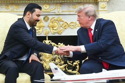 US President Donald Trump shakes hands with Prime Minister of Iraq Ali Al Zaidi. AFP