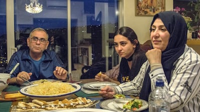 Adeeb Sami, his daughter Hamsa and his wife Sana, spending what was expected to be the last iftar of Ramadan at his home in Christchurch, New Zealand. Dave Walker/ The National.