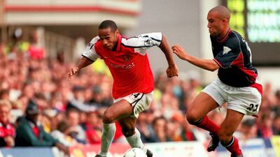 Arsenal's Thierry Henry takes on Manchester United's Mikael Silvestre. Getty