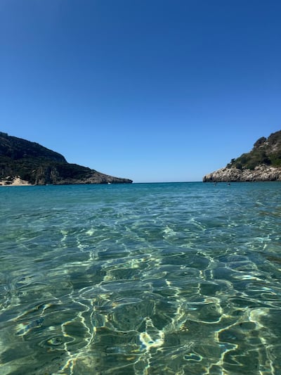 Crystal-clear Ionian waters sparkle at Omega beach. Gemma White for The National