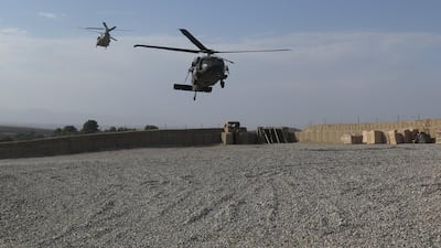 Nato helicopters land at an Afghan and US Special Forces base in Deh Bala district of Nangarhar province on July 7, 2018. James Mackenzie / Reuters