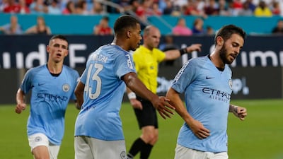 Manchester City's Bernardo Silva is congratulated by teammatesafter his goal. EPA