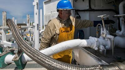 Miguel Cortillo gets a tanker of liquefied natural gas ready at Stabilis Energy in George West, Texas. So far, trade skirmishes may seem promising for other energy exporters as the costs of US energy production will be raised. AP
