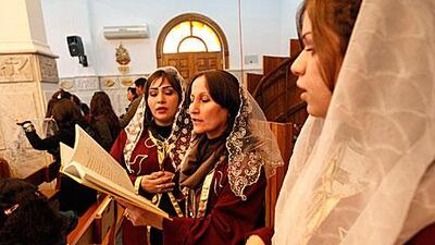 Iraqi Christians attend a mass on Christmas at the Virgin Mary church in Baghdad.