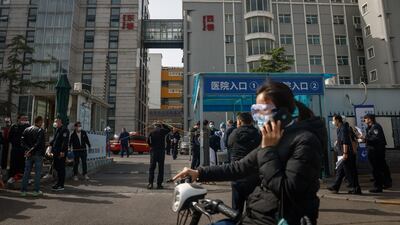 People gather outside. EPA