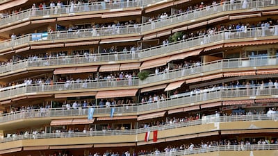 Spectators on balconies watch the Formula One Grand Prix at the Circuit de Monaco racetrack. EPA