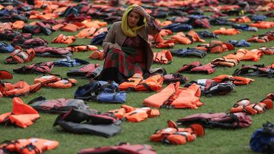 2,500 lifejackets, worn by refugees during crossings from Turkey to the Greek island of Chios, are displayed on Parliament Square, opposite the Houses of Parliament, in central London, during a photcall to highlight the number of refugees that have died trying to reach Europe since 2015. A summit to address the biggest refugee crisis since the Second World War opens at the United Nations on Monday, overshadowed by the ongoing war in Syria and faltering US-Russian efforts to halt the fighting. World leaders will adopt a political declaration at the first-ever summit on refugees and migrants that human rights groups have already dismissed as falling short of the needed international response. Daniel Leal-Olivas / AFP