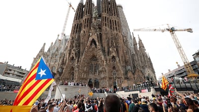 Catalan demonstrators chant slogans in front of La Sagrada Familia basilica during Catalonia's general strike in Barcelona, Spain, October 18, 2019. REUTERS/Albert Gea