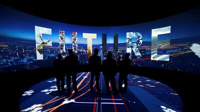 Visitors watch a 3D presentation during an exhibition on Neom. Crown prince Mohammed says the vast project will be listed on markets alongside Aramco. Faisal Al Nasser/Reuters