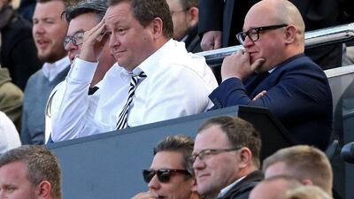 Newcastle United's owner Mike Ashley, center, and managing director Lee Charnley, right, look on ahead of the English Premier League football match between Newcastle United and Tottenham Hotspur at St James' Park in Newcastle-upon-Tyne, north east England on May, 15, 2016. (AFP/Scott Heppell)