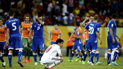 It was a heartbreaking outcome for Shinji Kagawa's Japan after their defeat to Italy. Sebastiao Moreira / EPA