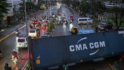 A shipping container blocks a road in Mandaue city, Cebu province. AFP