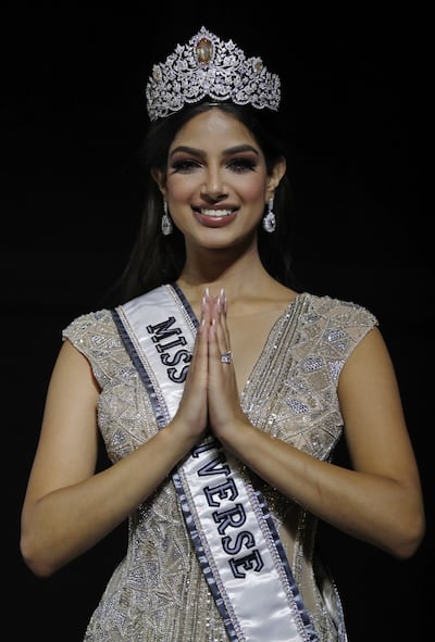 The new Miss Universe Harnaaz Sandhu of India gestures to the audience after being crowned at Miss Universe 2021. EPA