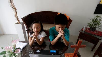 Sunday school children from Batak Christian Protestant Church attend an online service to mark Good Friday from home amid the coronavirus pandemic in Banda Aceh, Indonesia. EPA