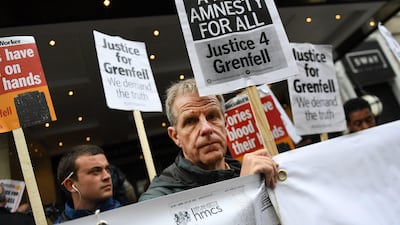 Protesters demonstrated outside the Grenfell Inquiry in London. Retired High Court judge Sir Martin Moore-Bick opened the public inquiry into the causes of the Grenfell Tower fire. Andy Rain/EPA
