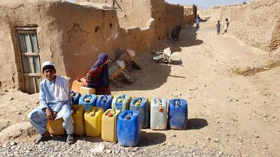 Afghan refugees wait to fill jerry cans with water from a community well at their refugee camp on the eve of World Refugees Days, in Pishin, Balochistan province, Pakistan, 19 June 2020. Pakistan hosts more than 1.5 million Afghan refugees and has repatriated more than one hundred thousand refugees back to their country in the last two years. World Refugee Day is marked annually on 20 June. EPA