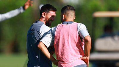 Lionel Messi and Jordi Alba chat at training. Getty