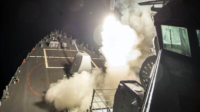 An image provided by the US navy showing the USS Ross firing a Tomahawk land attack missile on April 7, 2017, from the Mediterranean Sea, striking the Shayrat airbase near Homs, Syria. Mass Communication Specialist 3rd Class Robert S Price/US navy via AP