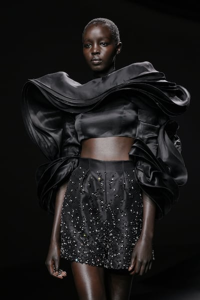 A voluminous top is mixed with beaded shorts at the Ashi Studio couture spring 2023 show. Getty Images