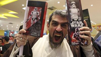 A man dressed as Obi-Wan Kenobi reacts. Paulo Whitaker / Reuters