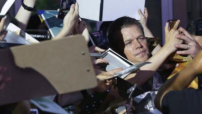Actor Matt Damon takes a selfie with fans during a promotional event for his latest film “Jason Bourne” in Seoul, South Korea. The film will be released in South Korea on July 27. Ahn Young-joon / AP