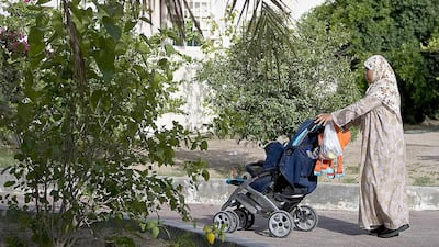 A domestic worker takes a child out for a stroll in the Nad Al Sheba neighborhood in Dubai: this week, columnist Saeed Saeed discusses how the people who work in our homes should be treated with the utmost respect. Amy Leang / The National