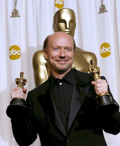 Director Paul Haggis holds his Oscars for 'Original Screenplay' and 'Best Picture of the Year' for 'Crash' at the 78th annual Academy Awards in 2006. EPA