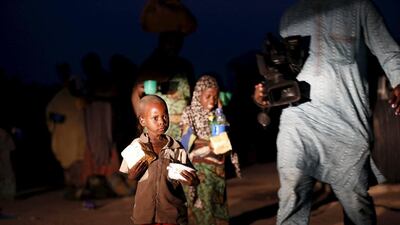One of the children rescued from Boko Haram, seen here holding a piece of bread after arriving at the Malkohi camp for internally displaced people in Yola, Nigeria on May 2, 2015. Tthe Nigerian army stormed the militants' hideout in the Sambisa forest to rescue at least 275 people who were kidnapped. Afolabi Sotunde/Reuters