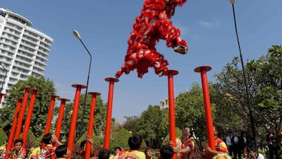 Members of a lion dance troupe perform in Phnom Penh, Cambodia. AFP