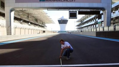 ABU DHABI - 31OCT2011 - Hugh Jones awarded Yas Marina certification after two days measuring the track.