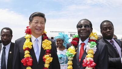 Chinese President Xi Jinping is welcomed byMugabe in Harare on December 1, 2015 Xi arrived here Tuesday for a state visit to Zimbabwe