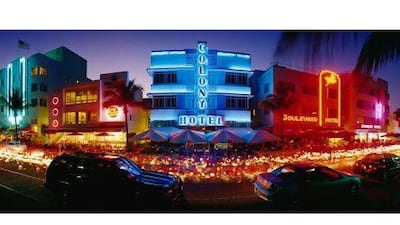 'At night, South Beach turns itself into an arresting urban film set, a procession of cool curves of Art Deco buildings illuminated by sci-fi force fields of neon lighting in red, blue and yellow.' Panoramic Images