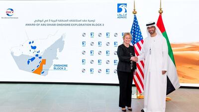 Dr Sultan Al Jaber, Adnoc Group chief executive, and Vicki Hollub, chief executive of Occidental Petroleum, shake hands after signing documents. Occidental will hold a 100 per cent stake in the exploration phase of the Block Three onshore concession. Courtesy Adnoc