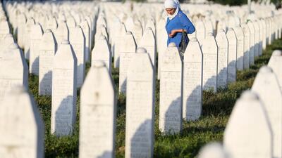 A woman walks among graves in Memorial Center Potocari, near Srebrenica, Bosnia and Herzegovina. Reuters / Dado Ruvic