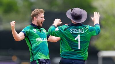 Ireland's Barry McCarthy, left, and captain Paul Stirling celebrate the wicket of Pakistan's Shadab Khan. McCarthy took three wickets for 15 runs. AP