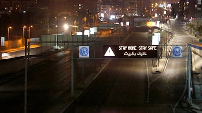 A digital road-sign displaying urging citizens to stay at home during a nighttime curfew imposed by the government to help stem the spread of the coronavirus in Beirut, Lebanon. AP